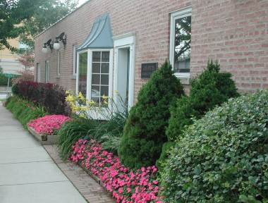 picture of our office building (one story, red common brick)